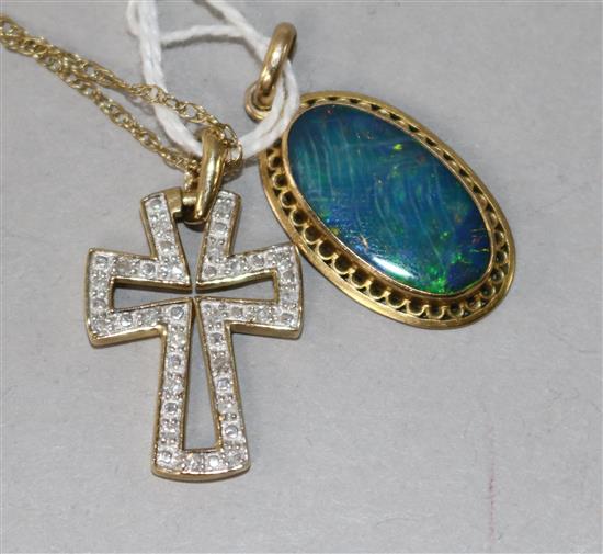 A 9ct gold and black opal pendant and a 9ct gold and diamond set cross pendant on a 9ct gold chain.